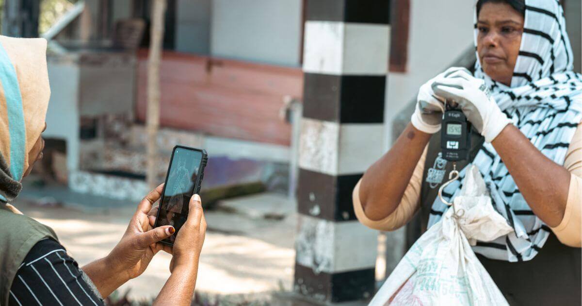 Two people working for cleanhub collecting plastic waste 