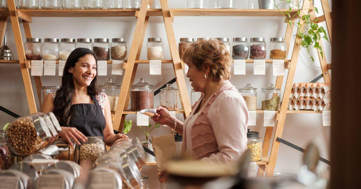 A customer talking to an employee at a sustainable retail shop 