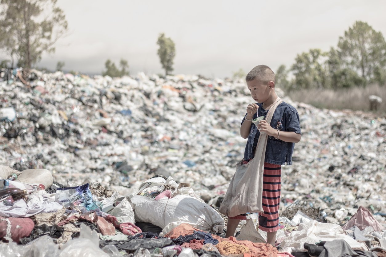 child working as waste picker